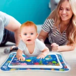 baby looks happy on tummy water pad