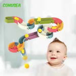 baby with toy in bath