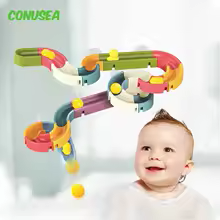 baby with toy in bath